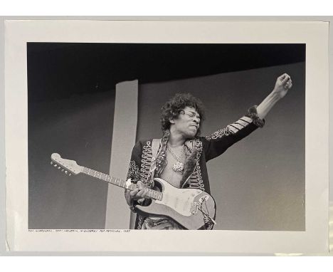 A large print of an image by Jim Marshall depicting Jimi Hendrix onstage at Monterey Pop Festival, 1967. Printed from the ori
