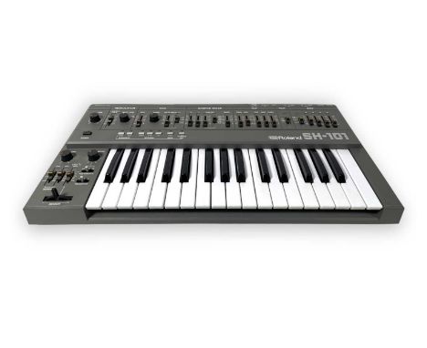 A Roland SH-101 monophononic synthesizer, with original owner's manual. Very clean condition. Powers on.