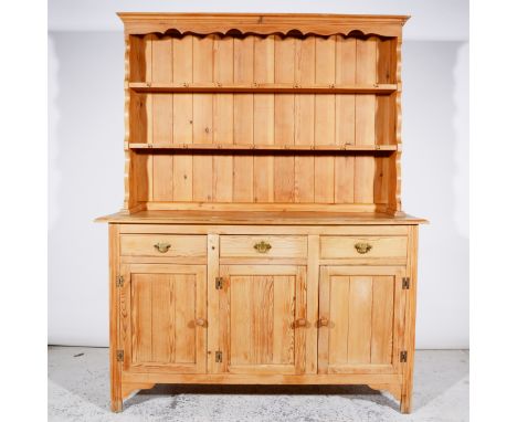 Modern pine dresser, two-shelf delft rack, base with three drawers over three panelled doors, width 143cm, height 177cm.