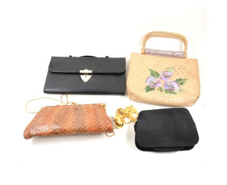 A collection of vintage handbags, including red leather bag by Bueno and matching gloves, large printed plastic bag depicting