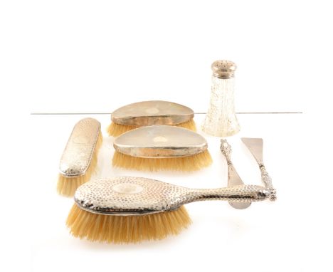 A silver topped glass dredger by John Grinsell &amp; Sons, Birmingham 1907, a pair of dressing table silver backed brushes, L