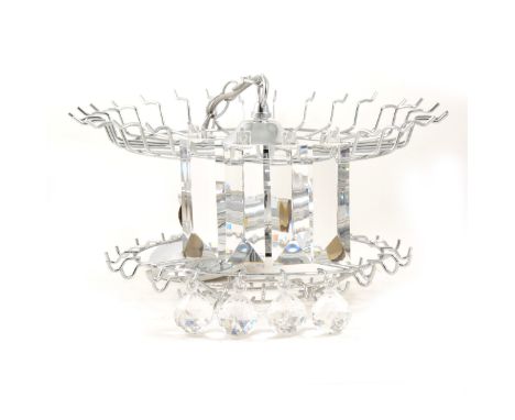 Contemporary chrome four-light centre fitting, with tiers of perspex facet pendants, supported from a circular frame, frame d