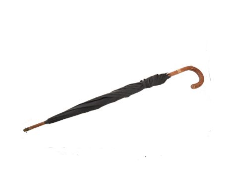 A vintage black umbrella with 9 carat yellow gold collar hallmarked London 1951, retractable pencil set into the handle.