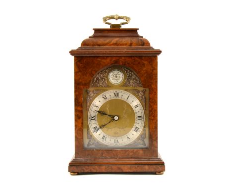 An Elliott walnut cased bracket clock, brass dial with silvered roman numeral chapter ring, keyless wind movement from back, 