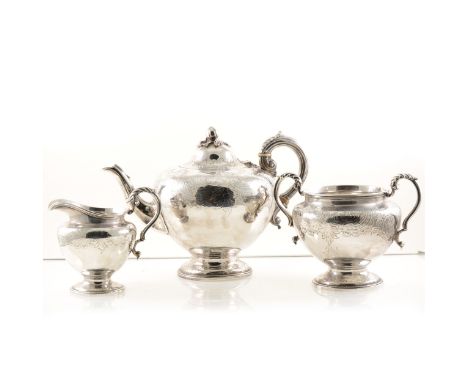 A silver teapot by A B Savory &amp; Sons (William Smily), with chased decoration, fruit finial, a hinged lid and a scroll han