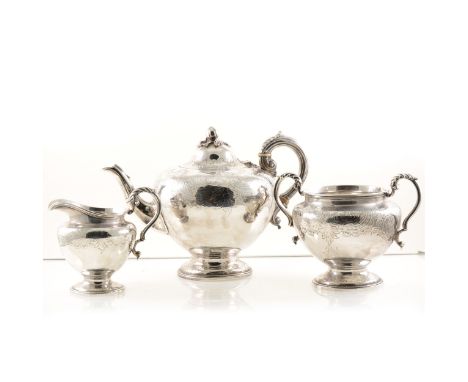 A silver teapot by A B Savory &amp; Sons (William Smily), with chased decoration, fruit finial, a hinged lid and a scroll han