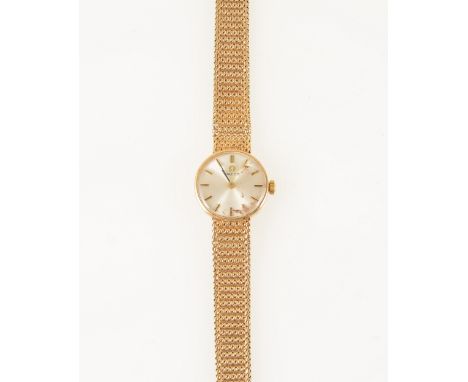 Omega - a lady's 9 carat yellow gold bracelet watch, circular champagne baton dial in a 9 carat yellow gold case fitted with 