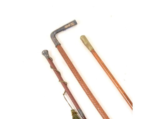 A swagger stick with metal pommel bearing the crest of O.T.C. Gresham School (Officers' Training Corps), overall 70cm, a smal