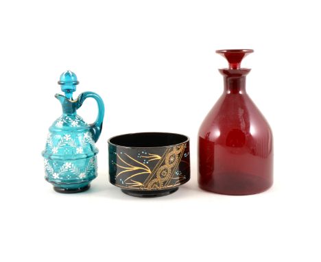 Ruby glass mallet-shape decanter, 22cm; four other decanters, and other glassware.