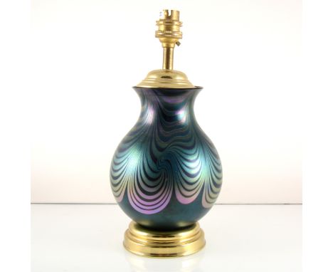 An Okra Glass iridescent table lamp by Richard P Golding, dated 1997, with swirling wave/ combed design, gilt metal mounts wi