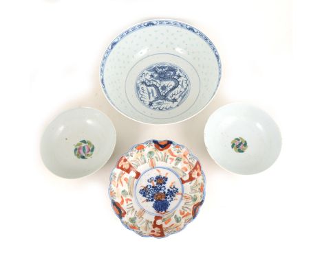 A Chinese blue and white rice-decorated rose bowl, decorated with a dragon chasing a flaming pearl, diameter 26 cm; a pair of