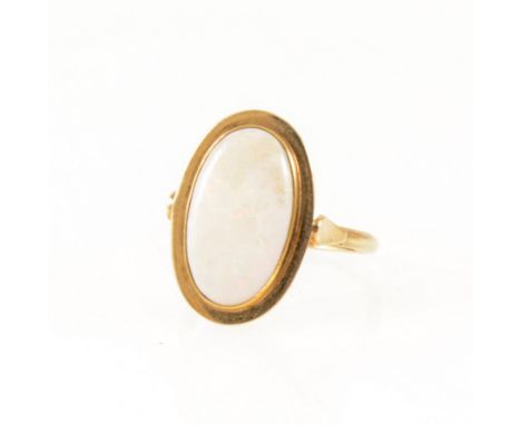 An opal dress ring, the oval cabochon cut stone, 17mm x 10mm, collet set in a yellow metal mount marked 585 on outside of sha