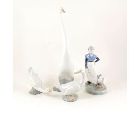 Royal Copenhagen figure of a Goose Girl, no.528, 20cm; two Nao models of geese; two other Spanish models of geese; and small 