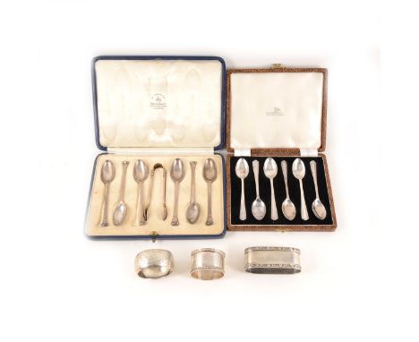 A cased set of six silver teaspoons with sugar tongs London 1929, five silver napkin rings, ivorine napkin ring with initial 