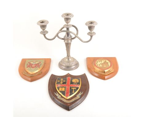 Plated three-light candelabra, 26cm; another three-light candelabra; armorial plaques, certificate; Kirby &amp; West T-shirts