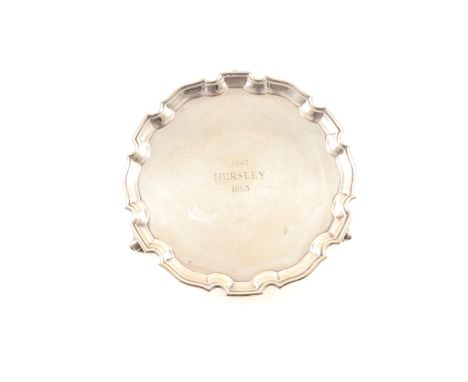 A small silver waiter by Carrington &amp; Co, with stepped Chippendale border, engraved to centre, London 1962, 20.5cm diamet