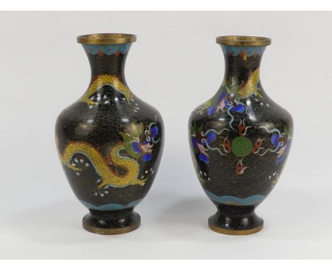 A pair of black ground cloisonne vases - decorated with dragons chasing the flaming pearl, height 16.5cm.