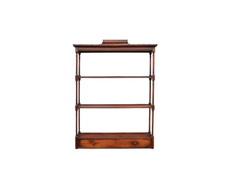 A Regency style mahogany hanging wall shelf - with a pagoda canopy above three shelves with turned supports, the lowest shelf