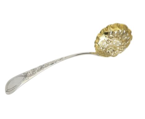 A George III silver sifter spoon - London 1795, repousse decorated with foliage and flowers, incorporating a gilt bowl, 35g.