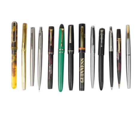 A collection of writing tools - including various Parker fountain pens.