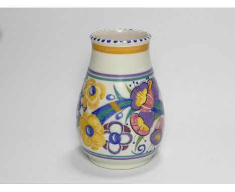 A Poole Pottery vase - of squat inverted baluster form, decorated with flowers, 16cm high.