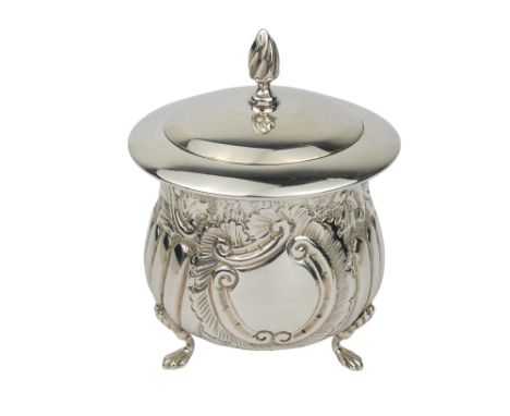 A small silver tea caddy - Birmingham 1903, William Devonport, decorated with a band of flowers and foliage and raised on thr