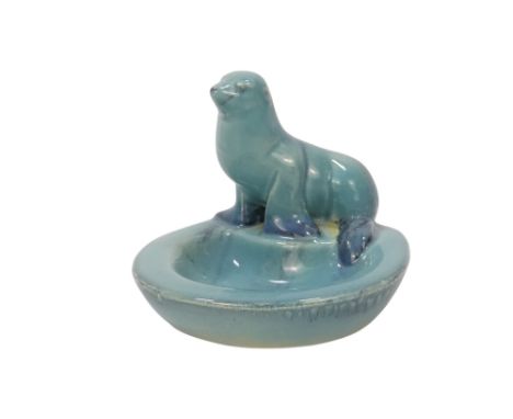A Beswick figure of a seal - mounted to a trinket dish, pale blue glaze with speckles, model 360, 12cm high.