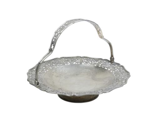 An early 20th century Chinese silver swing handle dish - with a pierced foliate rim and engraved with dragons, 17cm diameter,