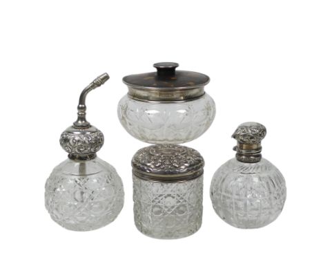 Three glass and silver mounted dressing table items - with clear cut glass bodies, one incorporating an atomiser, together wi