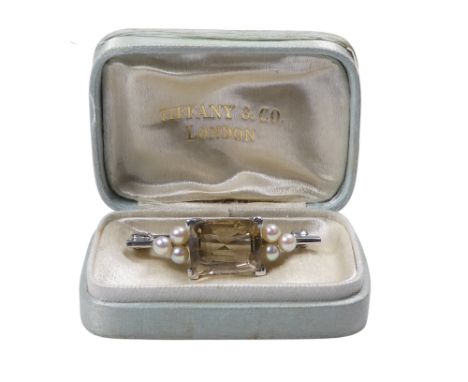 A platinum smoke quartz and pearl bar brooch - the rectangular faceted stone between clusters of three pearls, 6.3g, presente