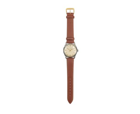 An Ebel gentlemans steel cased wristwatch - the cream dial set out with Arabic numerals and batons, on an associated tan leat