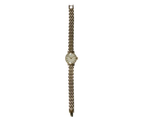 A ladies Rotary wristwatch with 9ct gold case - circa 1958, the cream dial set out in Arabic numerals, on a gold plated brace