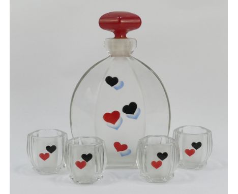 A glass decanter with red resin stopper - decorated with black and red hearts, together with four matches shot glasses.