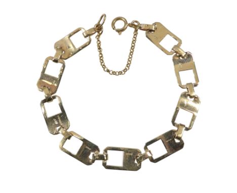 A 9ct gold bracelet - fancy rectangular link with engine turning, 11.6g.