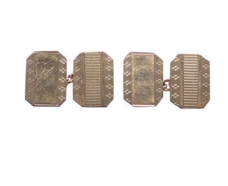 A pair of 9ct gold cuff links - rectangular with canted corners and engine turning, 3.7g.
