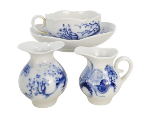 A 20th century Meissen cup and saucer - blue and white decorated in a chinoiserie style, together with a small jug and a simi