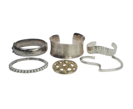 Four various silver bracelets and one white metal bracelet, together with a continental white metal circular Celtic brooch st