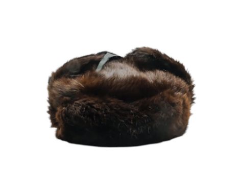 A mink fur hat - fitted with ear flaps.