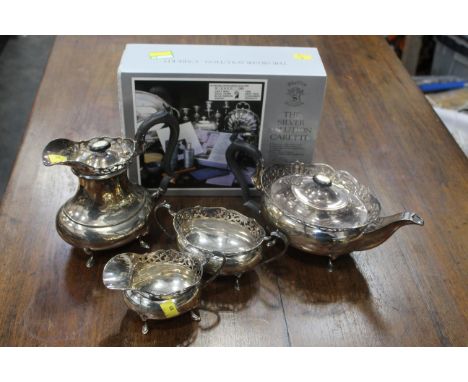 Four piece plated tea service and boxed silver care kit