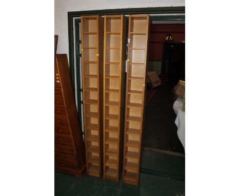 Three modern oak narrow shelf units/CD stands