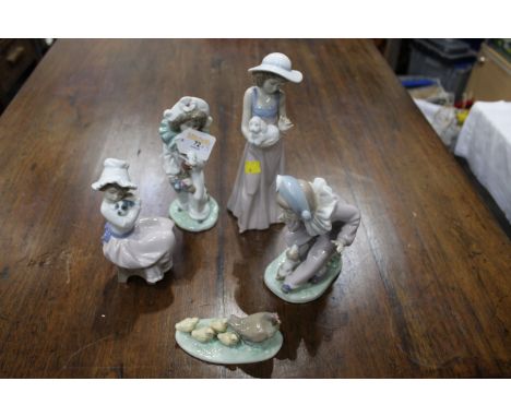 Four Nao figurines and bird ornament