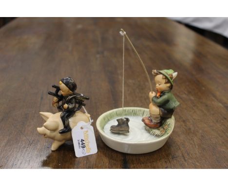 Goebel figures of child on pig and child fishing
