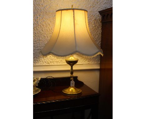 Brass effect table lamp and shade, 70 cm high.