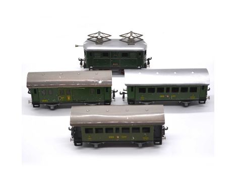 Buco (Bucherer) O gauge model railways, including clock-work locomotive no.212 0-4-0, green body; and three SBB / CFF coaches