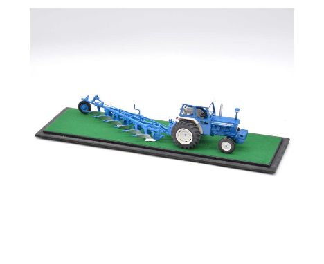 Britains farm model Ford 7000 tractor, with plough attachment, mount in custom display case. 