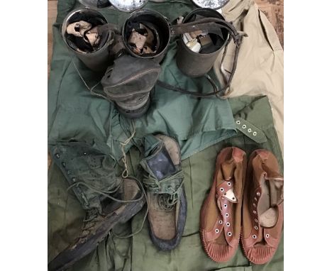 1950’s British Army tropical/jungle kit and WW2 gas masks, includes British Army pattern 44 jungle boots, issued gym shoes, N