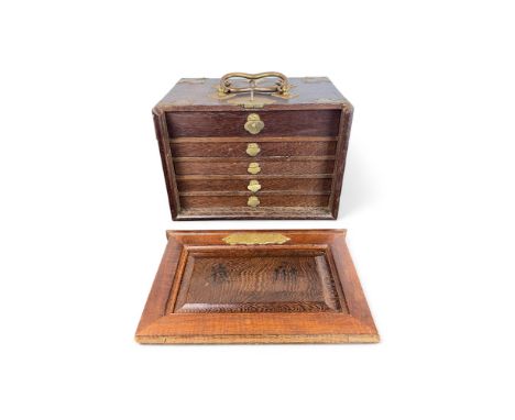 An early 20th century Chinese hardwood brass bound cased Mahjong set The box with carrying handles enclosing five drawers enc