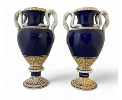 A pair of 19th century Meissen type neo-classical style cobalt blue and parcel gilt vases with snake handles Of urn form on l