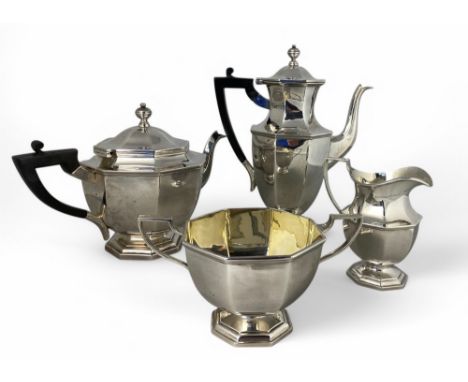 A George V silver coffee and tea set, Harrod Stores Ltd, London 1911 Comprising a coffee pot, a tea pot, a milk jug and a sug