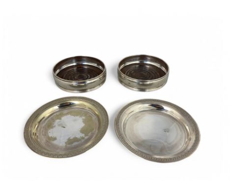 A pair of Elizabeth II silver wine coasters, David R Mills,&nbsp; London 1985 and a pair of Cristofle silver plated wine coas